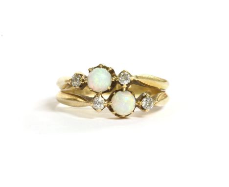 Two three stone opal and diamond rings joined as one, the opal cabochon claw set to four old cut diamonds, joined together at