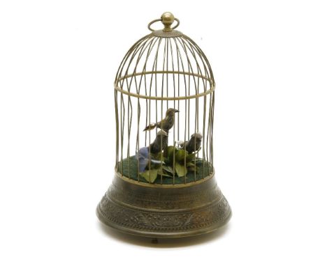 An automaton bird cage, 20th century, the domed cage containing three birds, and on circular spreading base, 29cm high
