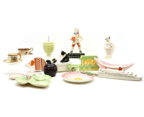 A collection of Carltonware pottery, a cow in a bath butter dish, pink flowers Brewmaster advertising stand, two money boxes,