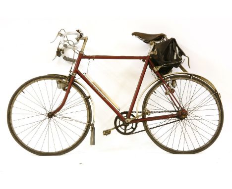 Two vintage bicycles, one by Raleigh, the other by Philips