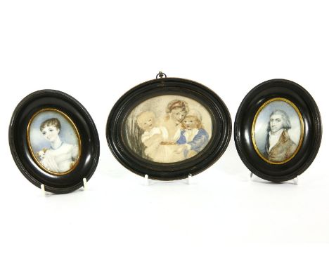 Two miniature portrait watercolours, a gent, a female with spaniel dog and three children