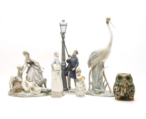 A collection of Lladro, to include a lamp lighter, an owl, a shepherdess, and other examples (Qty.)