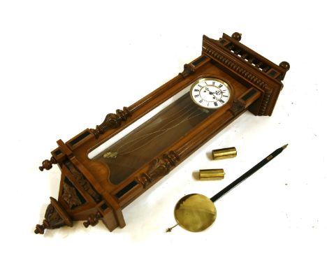 A 19th century walnut eight day Vienna regulator, the white enamel dial with Roman numerals, visual pendulum and weights with