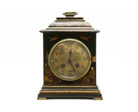 A Japanned mantle clock, 23cm high