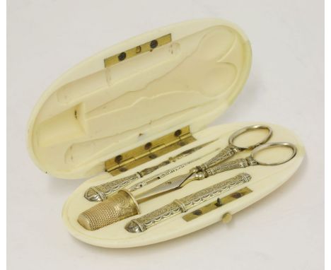 A 19th century Continental/English silver sewing nécessaire, comprising: a needle case, bodkin, stiletto, a pair of scissors,