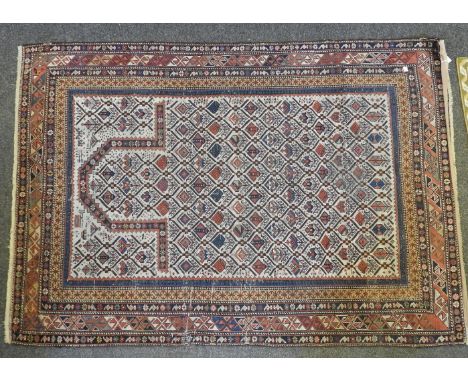 A cream ground prayer rug, the central panel within geometric borders, 163cm x 120, together with two small mats