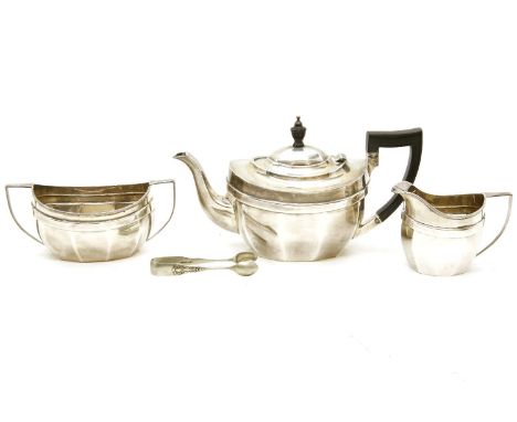 A hallmarked silver three piece tea service, comprising of a teapot, a sucrier and a cream jug of facetted ovoid form, Cheste