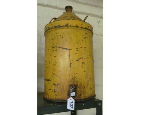 A large vintage diesel can with brass tap