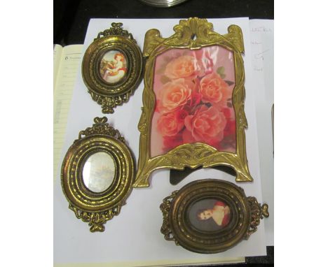 An Art Nouveau frame, modern frames and portraits