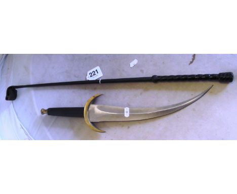 A dagger with curved blade and a whip