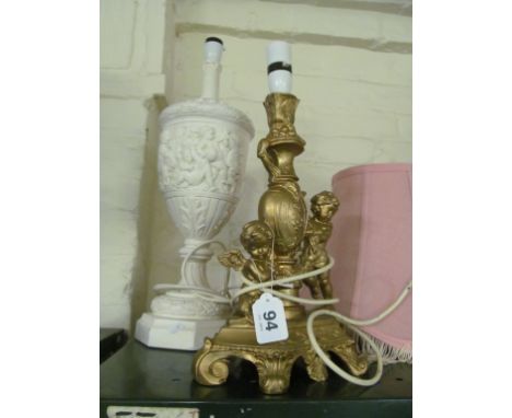 A white classical design lamp (fitting a/f) and a gilt table lamp cherubs