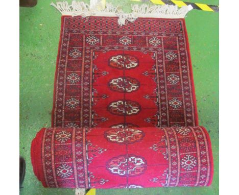 A Bokhara carpet runner about 15 foot long