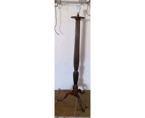 A mahogany standard lamp with fluted column