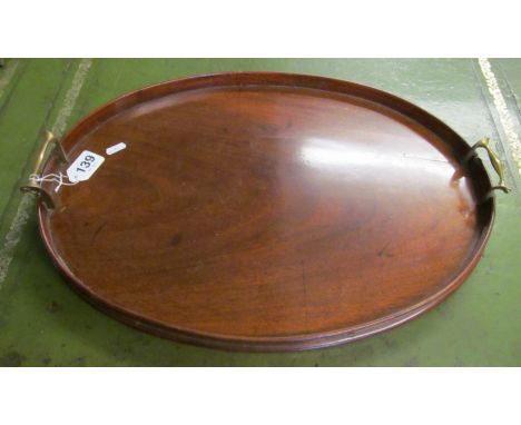 An oval mahogany two handled tray