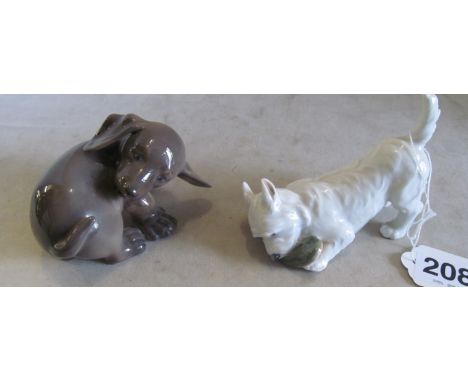 A Royal Copenhagen Dauschund no. 1407 and a Highland Terrier chewing a slipper no. 3476