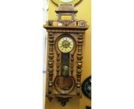 A wide 19th Century wall clock