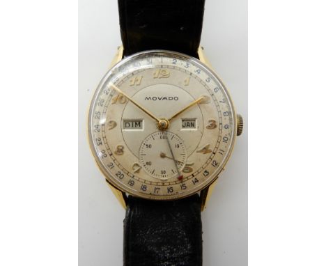 AN 18CT GOLD GENTS VINTAGE MOVADO WRISTWATCH with a fifteen jewel movement, diameter approx 3.2cm, weight including leather s