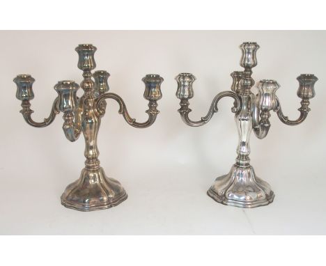 A PAIR OF GERMAN SILVER FIVE LIGHT CANDELABRA marked on the vase 830S with a crown and a lion (2), 38cm high, 2200gms Conditi