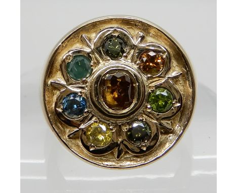 A 9CT GENTS RING SET WITH MULTI COLOUR DIAMONDS in blues, greens, yellow and cognac coloured diamonds, with an estimated appr