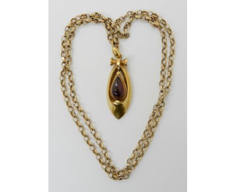 A VICTORIAN BRIGHT YELLOW METAL GARNET SET PENDANT with a Victorian kite mark to the reverse dating the pendant to 1872, leng
