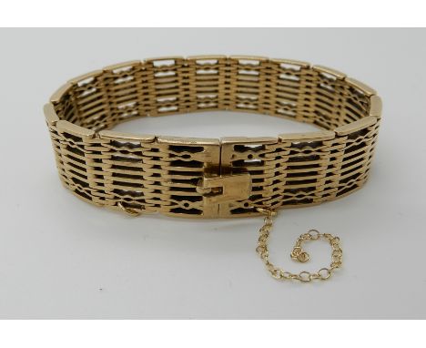 A 9CT GOLD FANCY LINK BRACELET length 18cm, width 1.5cm, weight 42.1gms Condition Report: Light general wear, clasp works wel