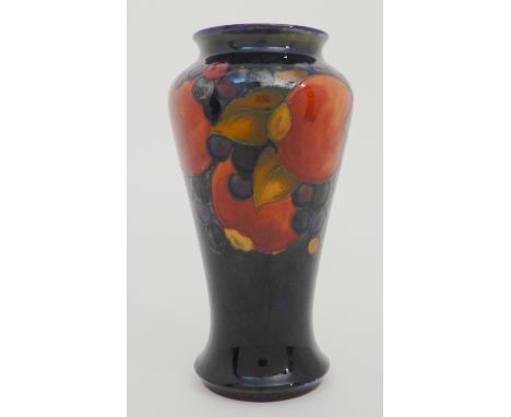 A MOORCROFT POMEGRANATE PATTERN VASE with tapering body, impressed and blue initials to base, 22.5cm high Condition Report: l