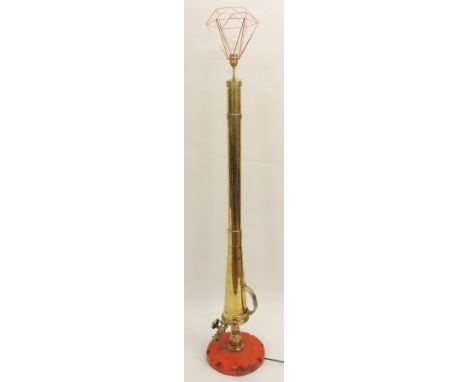 A PYRENE COMPANY BRASS STANDARD LAMP adapted from a 1920's water cannon with cast iron base and copper wire shade, 176cm high