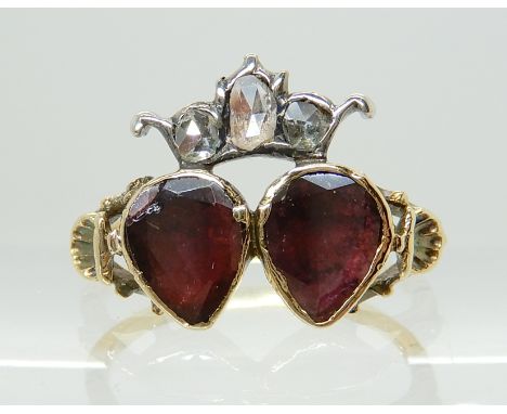 AN EARLY 19TH CENTURY  GARNET AND DIAMOND RING of crowned double heart design, with scallop shell detail to the shoulders. Al