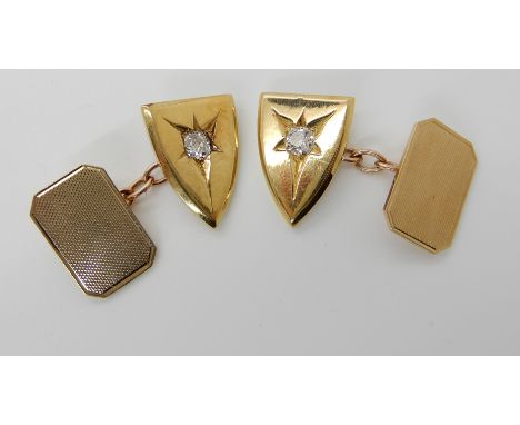 A PAIR OF 9CT GOLD SHIELD SHAPED DIAMOND SET CUFFLINKS each shield set with a 0.20ct old cushion cut diamond, dimensions of s