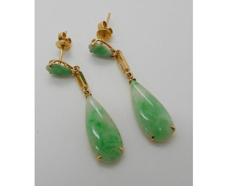 A PAIR OF CHINESE GREEN HARDSTONE DROP EARRINGS made in bright yellow metal the butterflies stamped 585 14k, length of drop 3