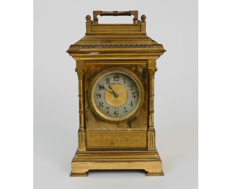 A FRENCH GILDED BRASS CASED MANTLE CLOCK the silvered dial marked for Edward and Sons, Paris, the movement marked 5 15, 22cm 