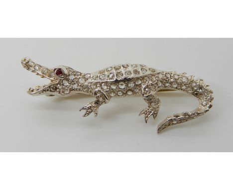 A ROSE CUT DIAMOND AND RUBY CROCODILE BROOCH mounted in white metal, length 4.6cm, weight 4.8cm Condition Report: All diamond