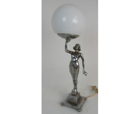 AN ART DECO CHROMED LADY LAMP modelled as a semi-clad maiden holding aloft a bowl which supports the white globe shade, base 