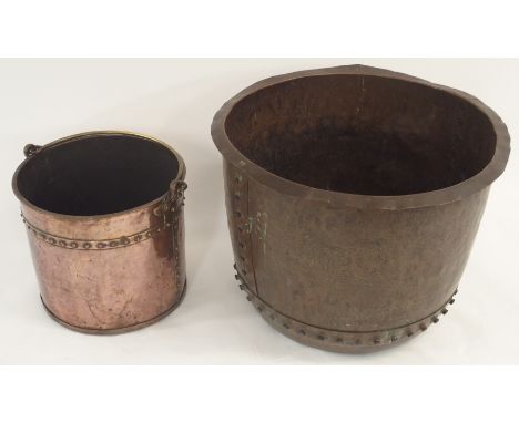 A VINTAGE RIVETED COPPER LOG CONTAINER with swing handle, 34cm high x 35cm diameter and a large copper planter, 43cm high x 5