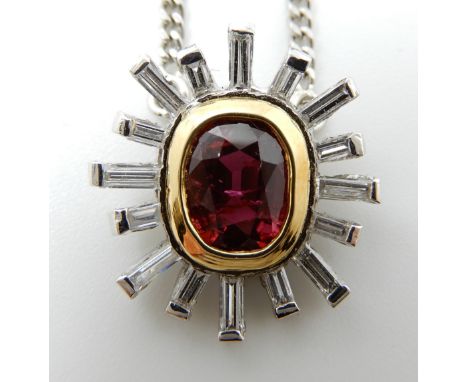 AN 18CT WHITE GOLD RUBY AND DIAMOND STARBURST PENDANT approx ruby dimensions 7mm x 5mm x 4.1mm, with a halo of fine needle ba