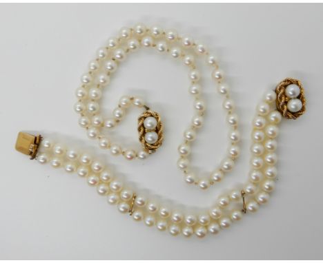 A PEARL NECKLACE AND BRACELET SET WITH 14K GOLD CLASPS length of the single strand necklace, 38cm, pearls all approximately 6