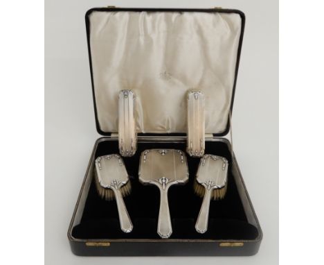 A FIVE PIECE SILVER DRESSING TABLE SET in unassociated case, by William Comyns &amp; Sons Limited, London 1934 (with unassoci