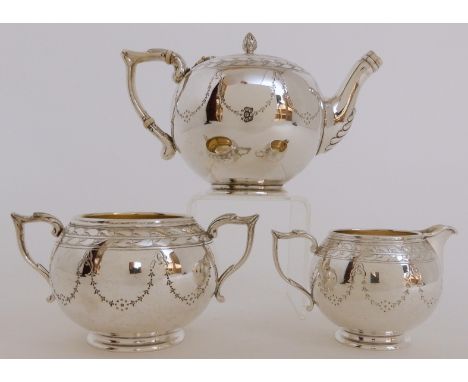 A BACHELOR'S VICTORIAN SILVER THREE PIECE TEA SERVICE by James and Walter Marshall, Edinburgh 1868, marked on the base by the