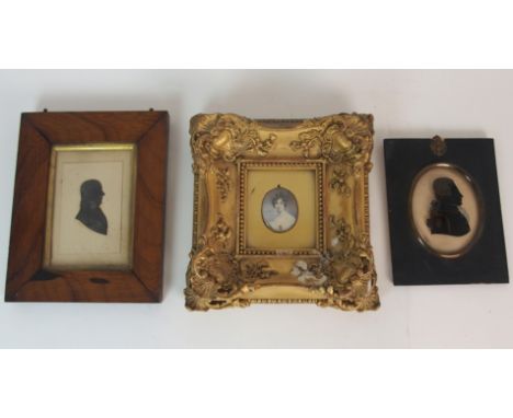 A VICTORIAN SILHOUETTE in rosewood frame, 12 x 8cm, a reverse painted silhouette, 10 x 9cm and a painted portrait miniature o