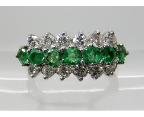 AN 18CT WHITE GOLD EMERALD AND DIAMOND ETERNITY RING each emerald is approx 3mm, and further set with 0.72cts of brilliant cu