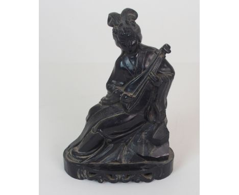 A CHINESE COAL CARVED FIGURE OF A MUSICIAN the female figure seated playing a Pipa, on a scroll carved base, 21cm high Condit