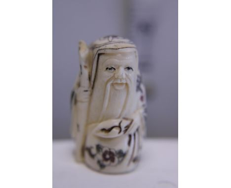 A hand carved Netsuke, signed to base 