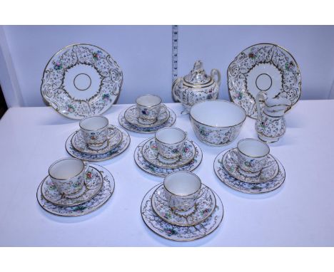 A pretty Victorian bone china tea service with gilt and flower decoration 
