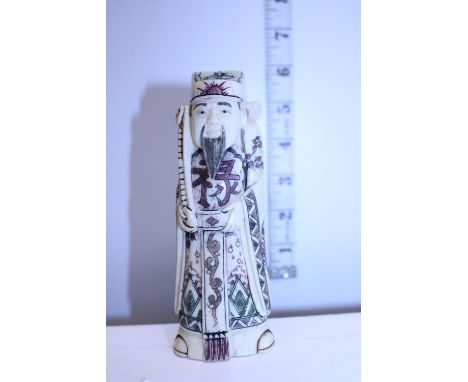A carved netsuke, signed to base 