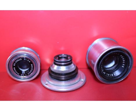 Three assorted camera lenses 
