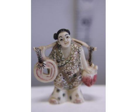 A hand carved Netsuke, signed to base 