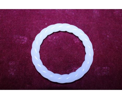 A Chinese White Jade bracelet finely carved with twist design 