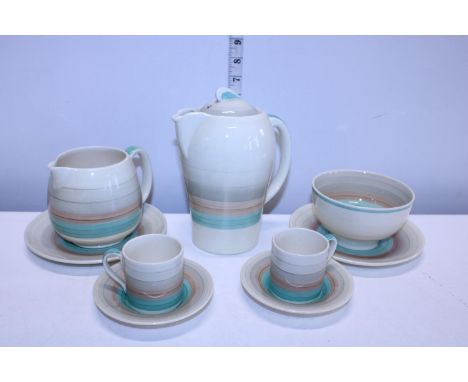 A selection of Susie Cooper 'Wedding Band' coffee pot, milk jug, sugar bowl and two coffee cans and saucers 