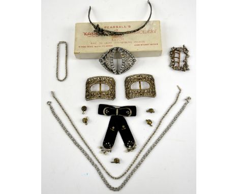 A group of paste set jewellery, pair of  openwork shoe buckles with design of flowers and bows, Circa 1910, a head piece, vel