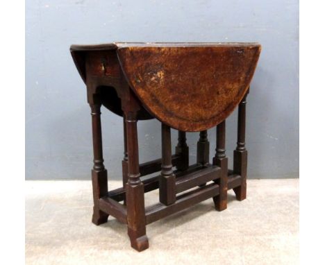 Mahogany shaped top card table(damaged) and an oak drop flap table.  